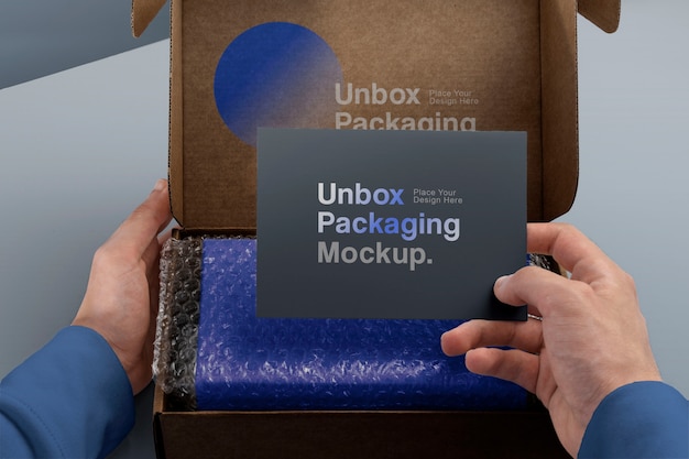 PSD view of person unboxing cardboard package