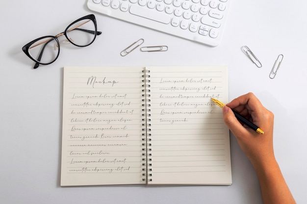 PSD view of person writing on paper with pencil