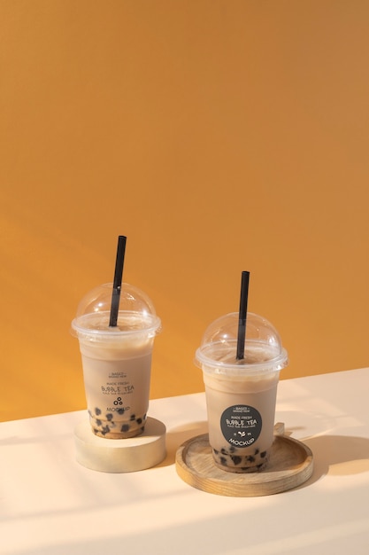 view of plastic cups with bubble tea and straws