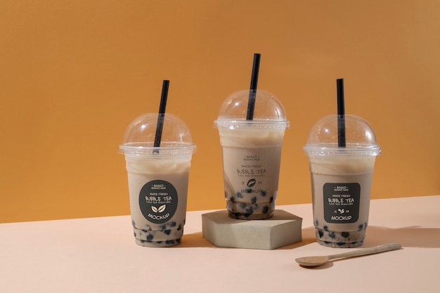 PSD view of plastic cups with bubble tea and straws