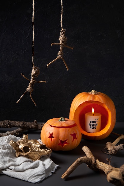 PSD view of spooky halloween pumpkin with lit candle