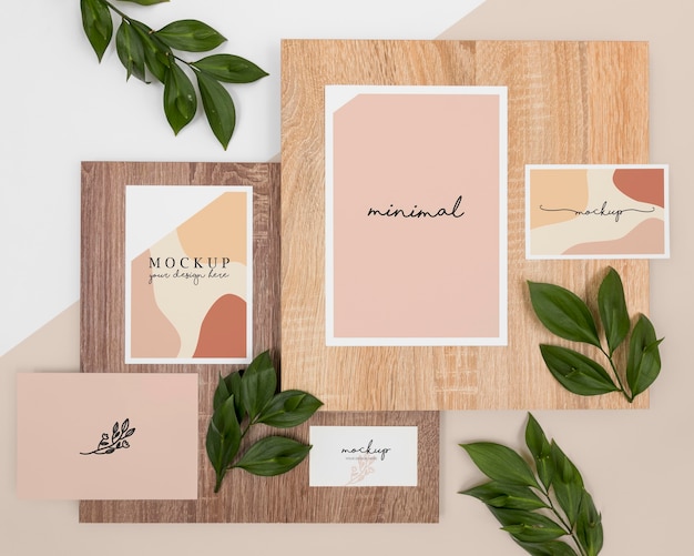 Above view stationery with leaves and wood