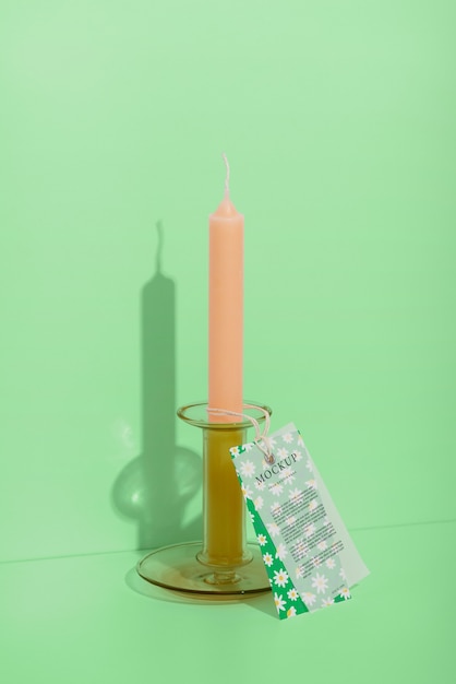 PSD view of wax candle stick with paper tag or card mock-up design