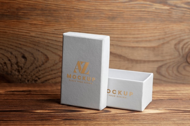 view of white cardboard box with golden engraving