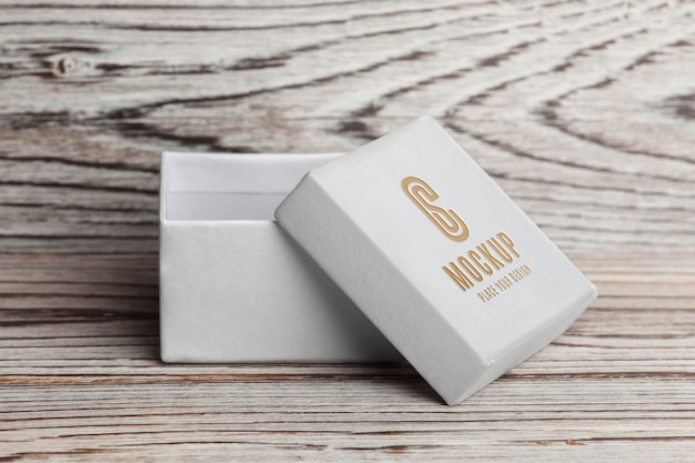 view of white cardboard box with golden engraving