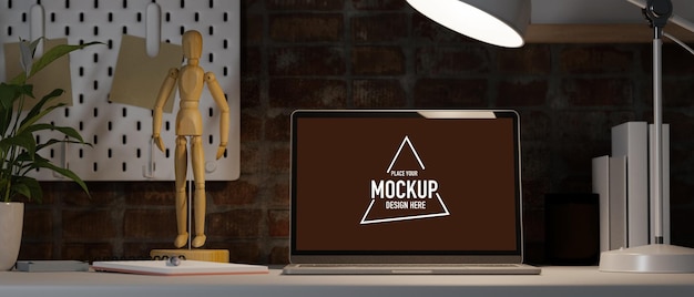vintage red brick working room with laptop mockup under light wooden figure house plant shelf