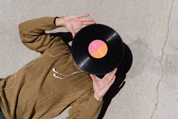 Vinyl record mockup held in hand