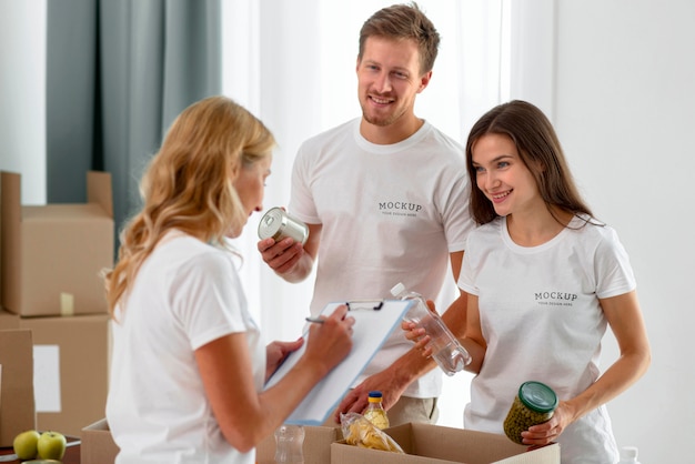 Volunteers preparing boxes of provisions for donations