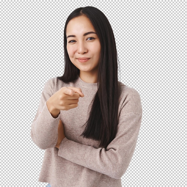 Vreugdevol, zelfverzekerd, Aziatische vrouw die een keuze maakt. Ze kiest jou. Ze wijst naar de camera en glimlacht.