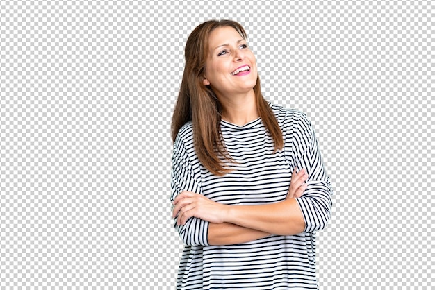 Vrouw van middelbare leeftijd over een geïsoleerde achtergrond gelukkig en glimlachend