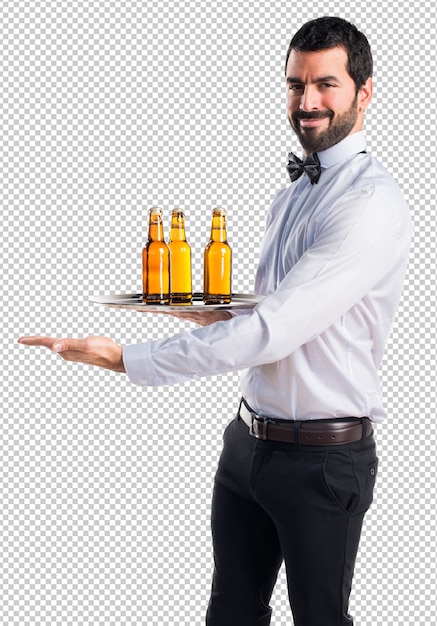 PSD waiter with beer bottles on the tray presenting something