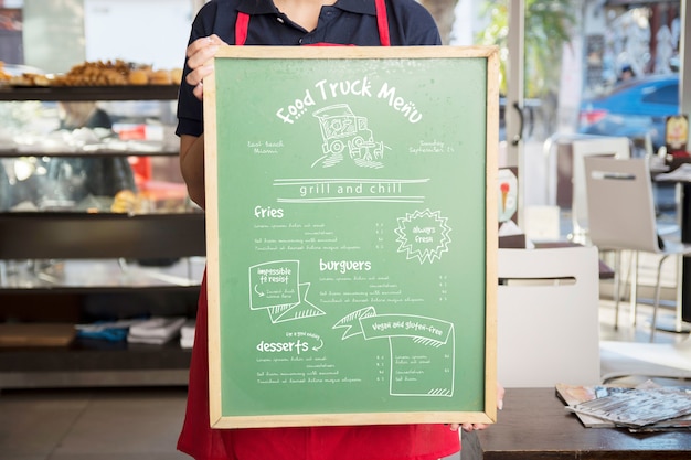 Waitress presenting board with menu