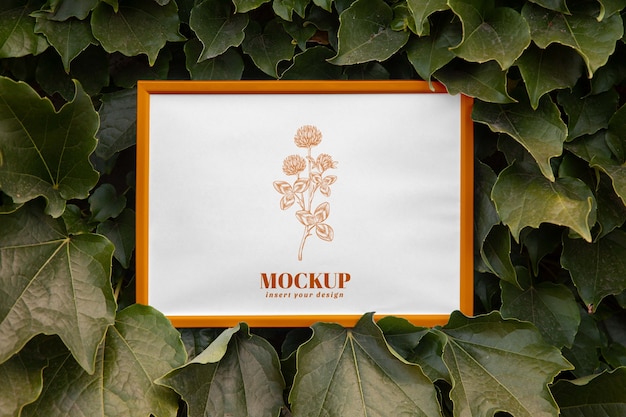 PSD design mock-up della cornice da parete con foglie e vegetazione