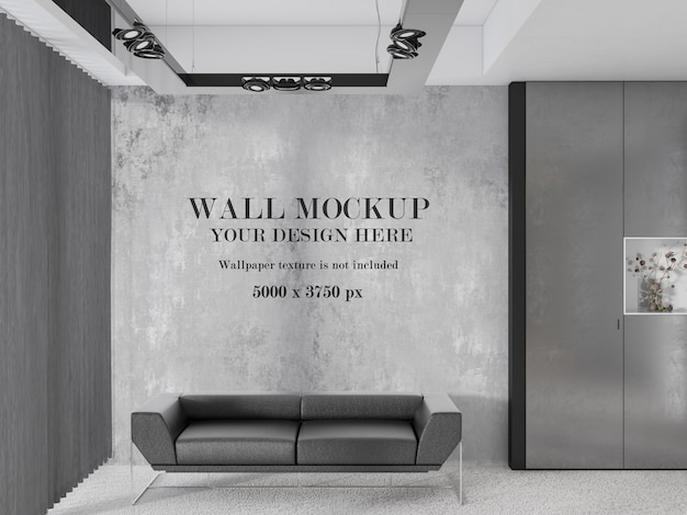 PSD wall mockup behind modern grey sofa