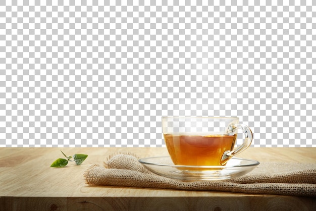 PSD warm cup of tea and tea leaf on the wooden table with transparent background png