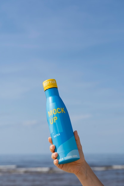 Water drop bottle mockup in nature