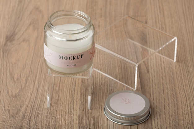 Wax candle in glass jar with label mock-up