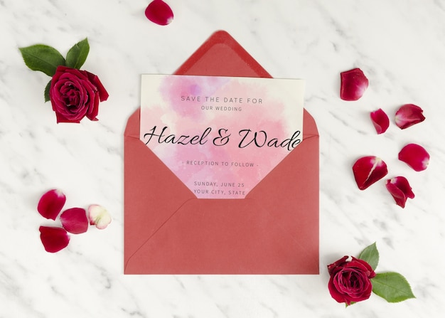 wedding invitation in an envelope with roses