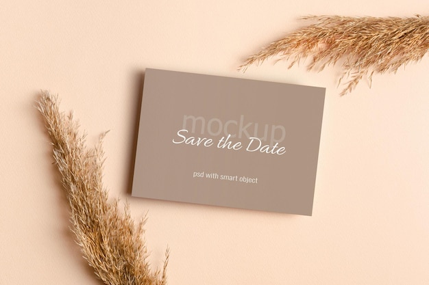 Wedding invitation or greeting card mockup with dry plant decorations