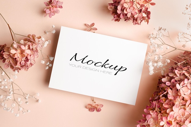 Wedding invitation or greeting card mockup with pink hydrangea flowers