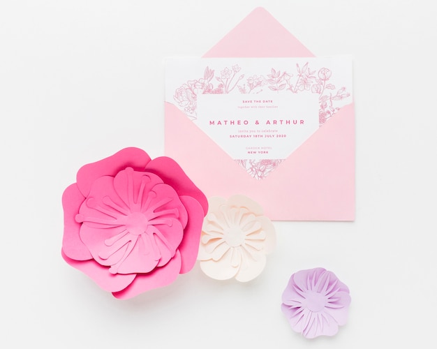 PSD wedding invitation mock-up with paper flowers on white background