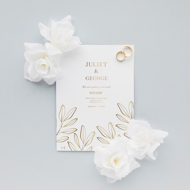 花とリングの結婚式の招待状