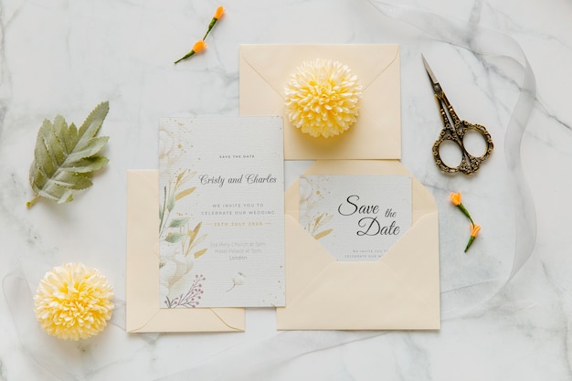 Wedding invitation with flowers and scissors