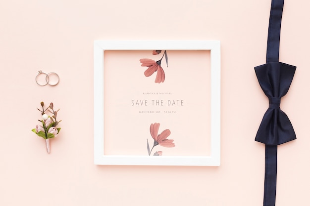 PSD wedding rings and bow tie with frame mock-up and flower