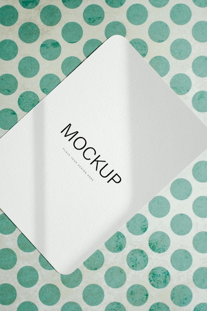 a white box with a green and blue polka dot pattern