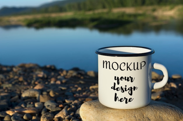 White campfire enamel mug mockup with blue river