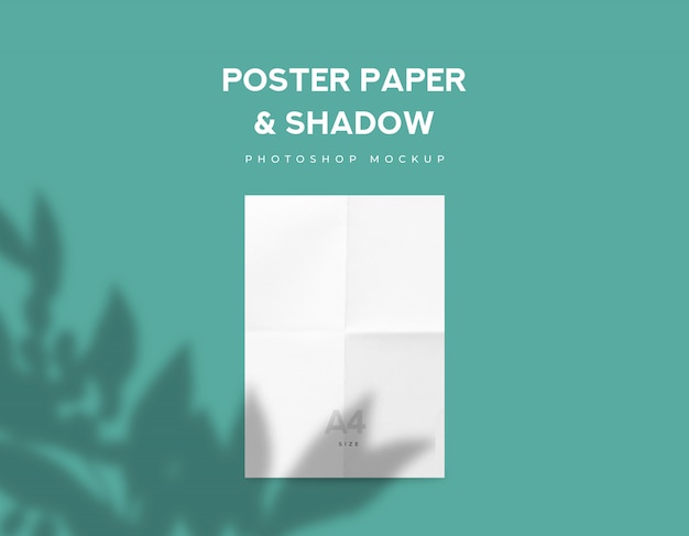 PSD white fold poster paper or flyer a4 size and leaves shadow on green mint background