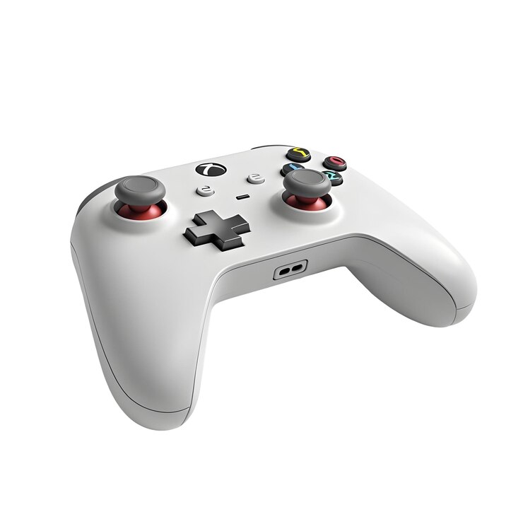 PSD a white and gray game controller with a black and red button