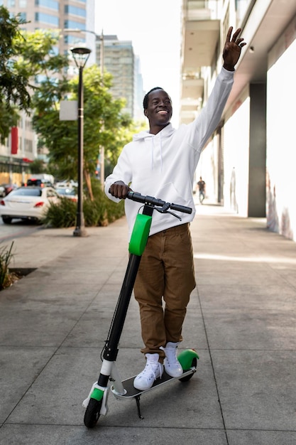 white hoodie mockup psd man riding scooter stylish apparel