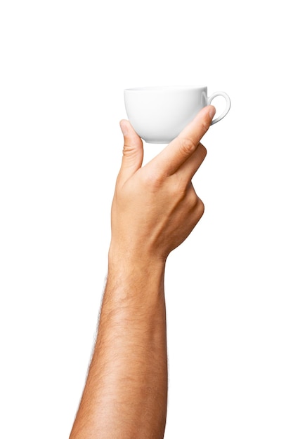 White mug in mans hand on empty background