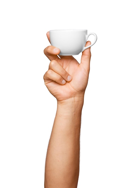 White mug in mans hand on empty background