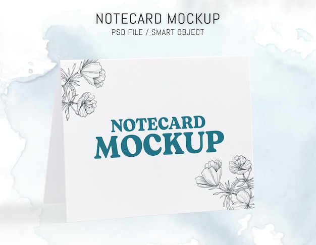 A white note card mockup with flowers on it