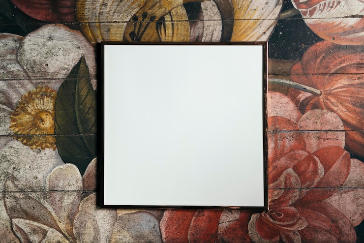 PSD white picture frame mockup on a floral patterned background