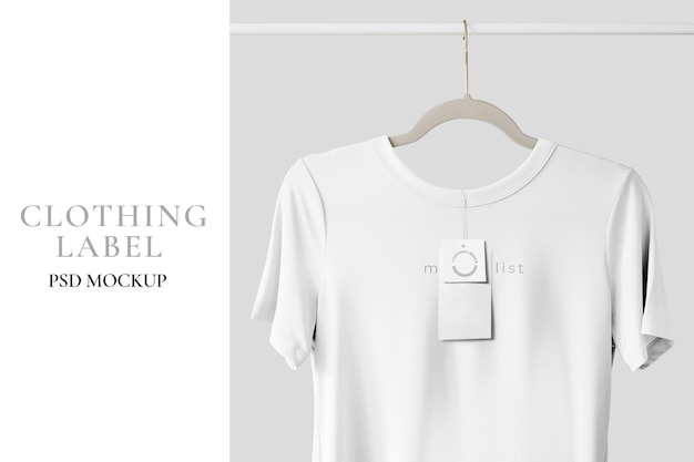 White t-shirt mockup hanging on a clothing rack