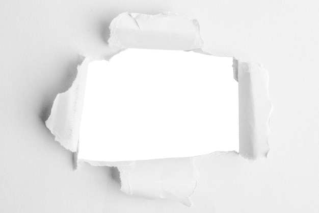 PSD white thick paper torn in the middle with an empty hole and an empty background behind