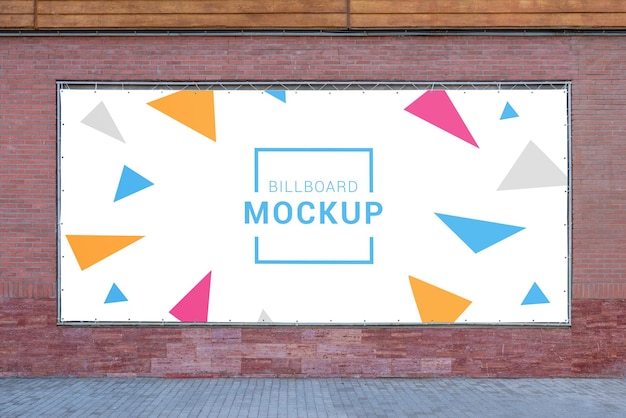 PSD wide tarpaulin billboard mockup on brick wall