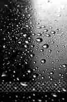 PSD a window with rain drops on it and a black and white checkered pattern on transparent background