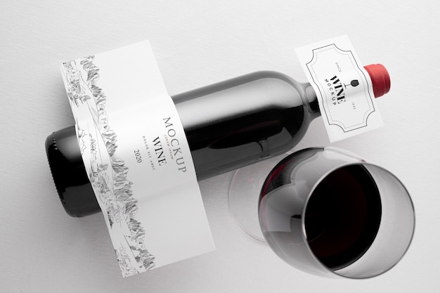 PSD wine bottle label  and glass mock up flat lay