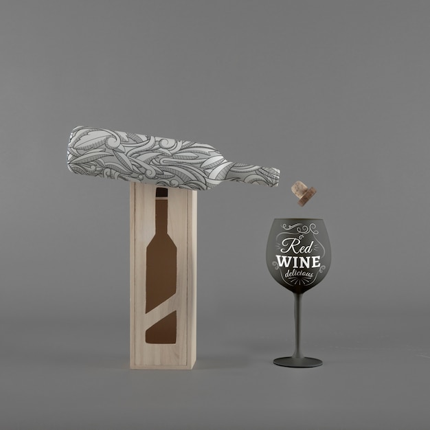 Mockup di bottiglia di vino con scatola e vetro