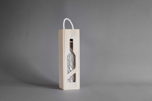 Wine bottle in wooden box mockup