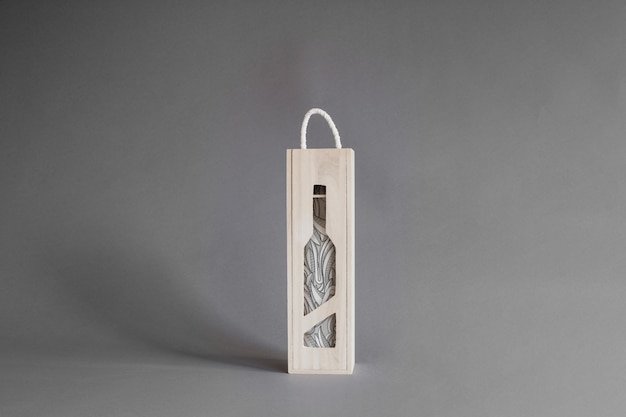 Wine bottle in wooden box mockup