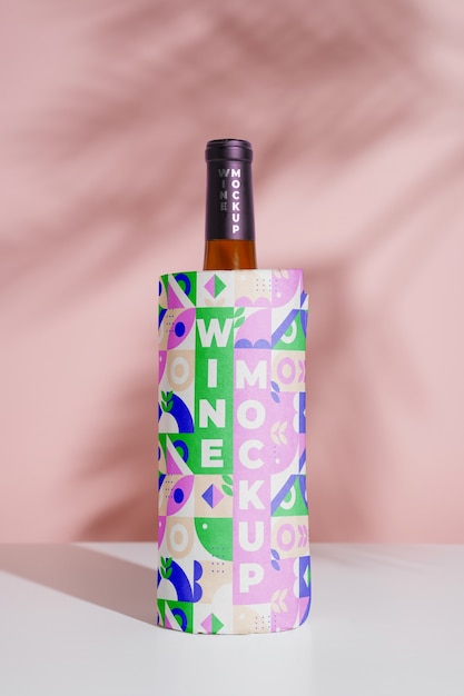 PSD wine bottle wrapped in colorful paper mockup