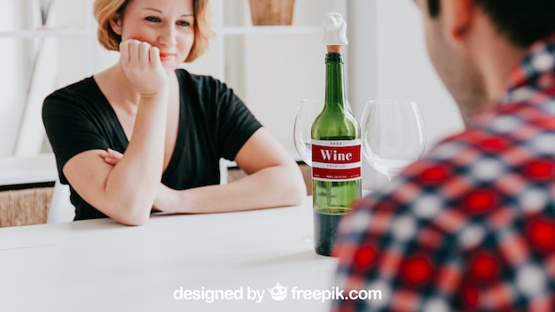 PSD wine mockup with couple at table