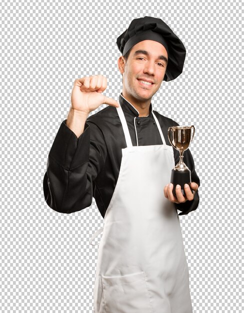 PSD winner young chef holding a gold cup