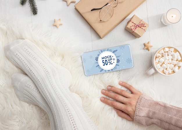 winter hygge composition with phone mock-up