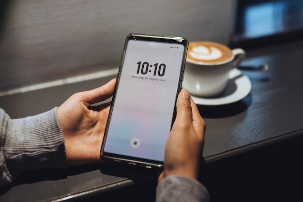 Woman in a cafe using her mobile phone